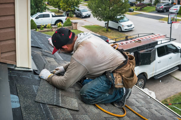 Professional Storm Damage Roof Repair technician working in Mantoloking, NJ